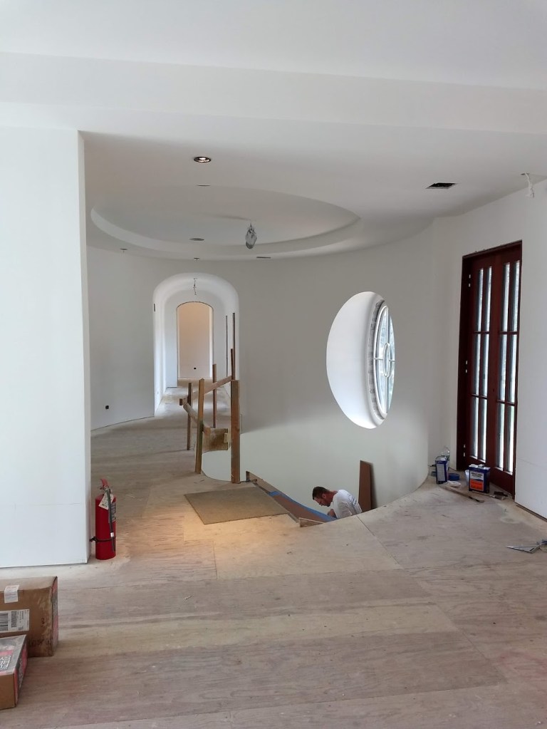 circular window molding drywall sanded ready to paint with custom arch door