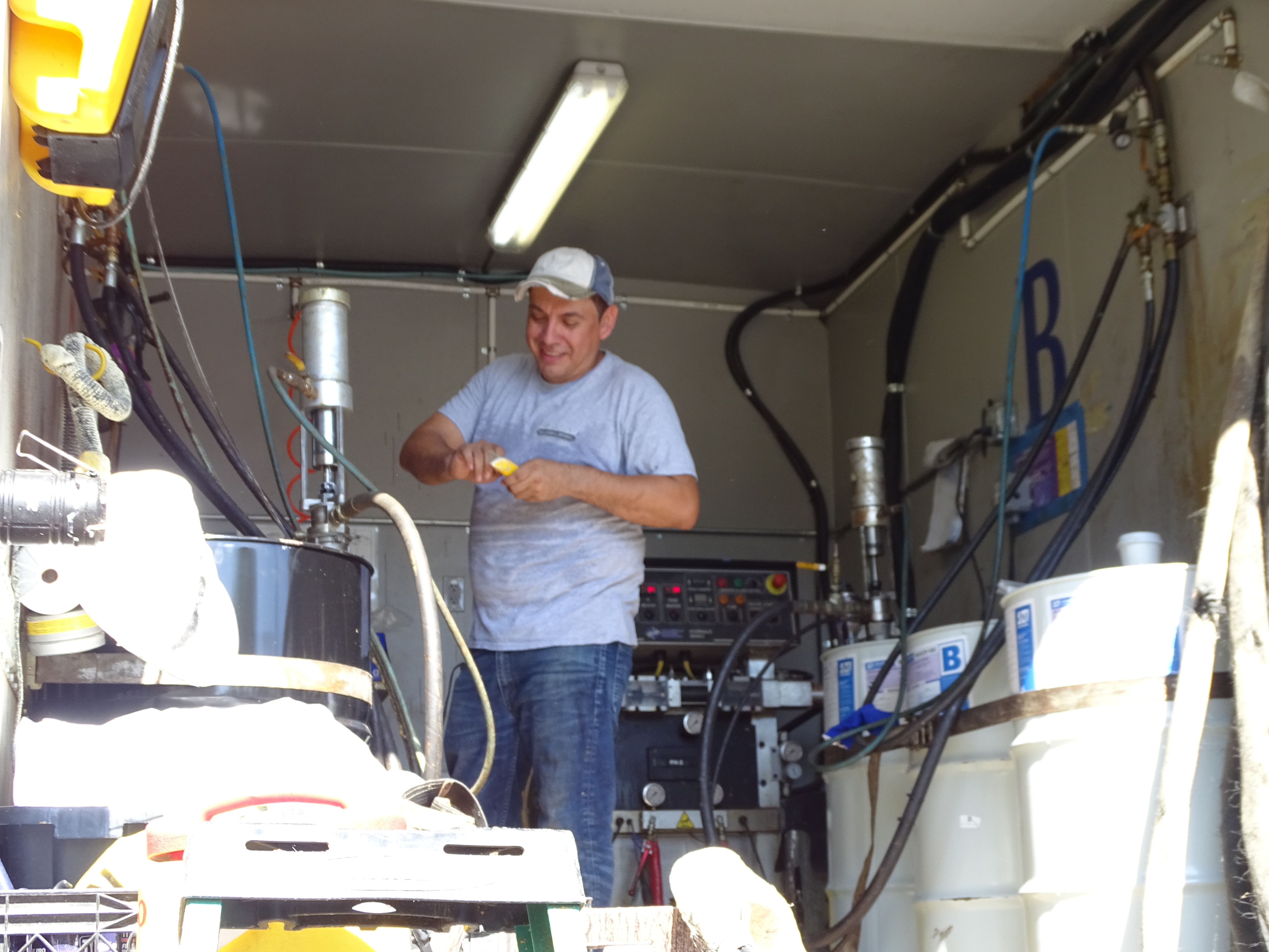 Oscar in spray foam truck preparing for the next job