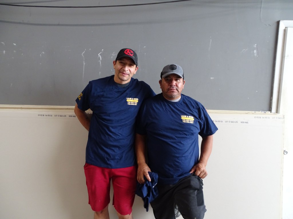 two workers standing