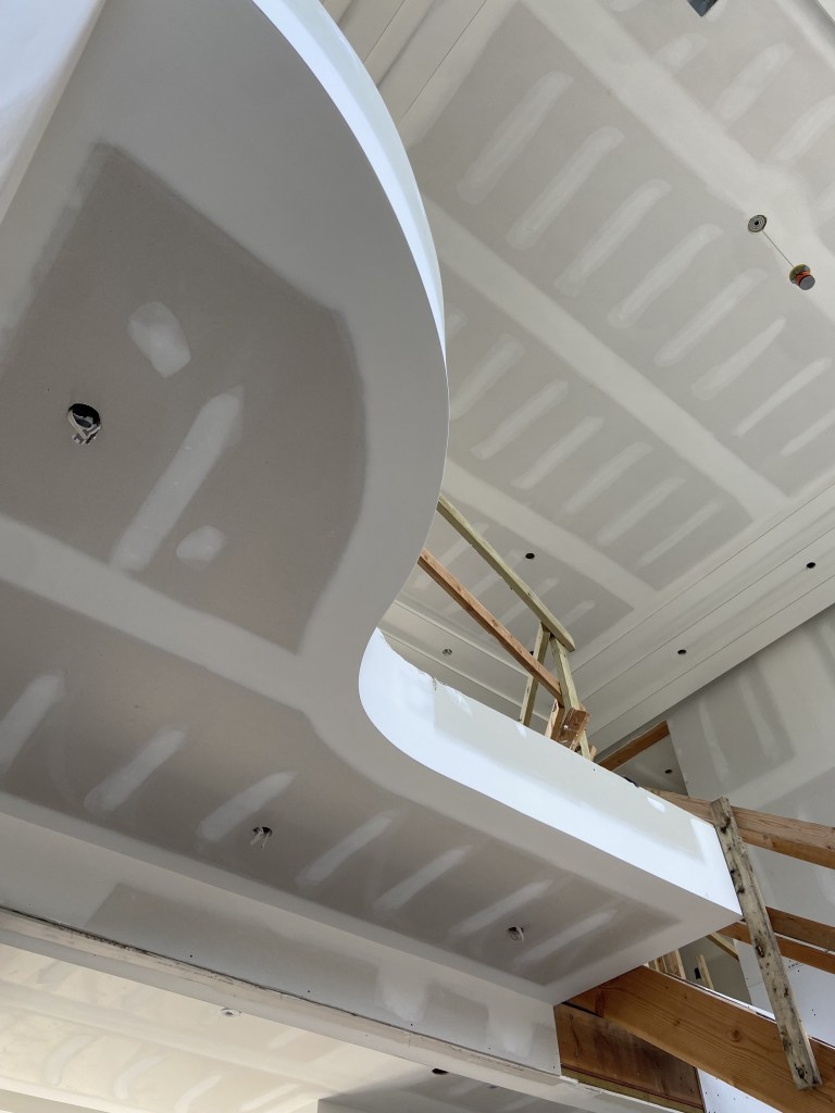 Curved balcony landing molded drywall in Long Branch, New Jersey. Sanded and ready for paint.