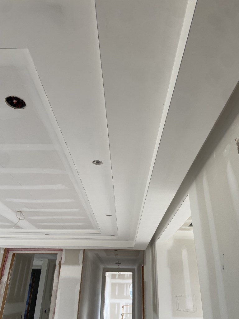 View of custom molded ceiling in Long Branch, New Jersey. Sanded and ready for paint. 