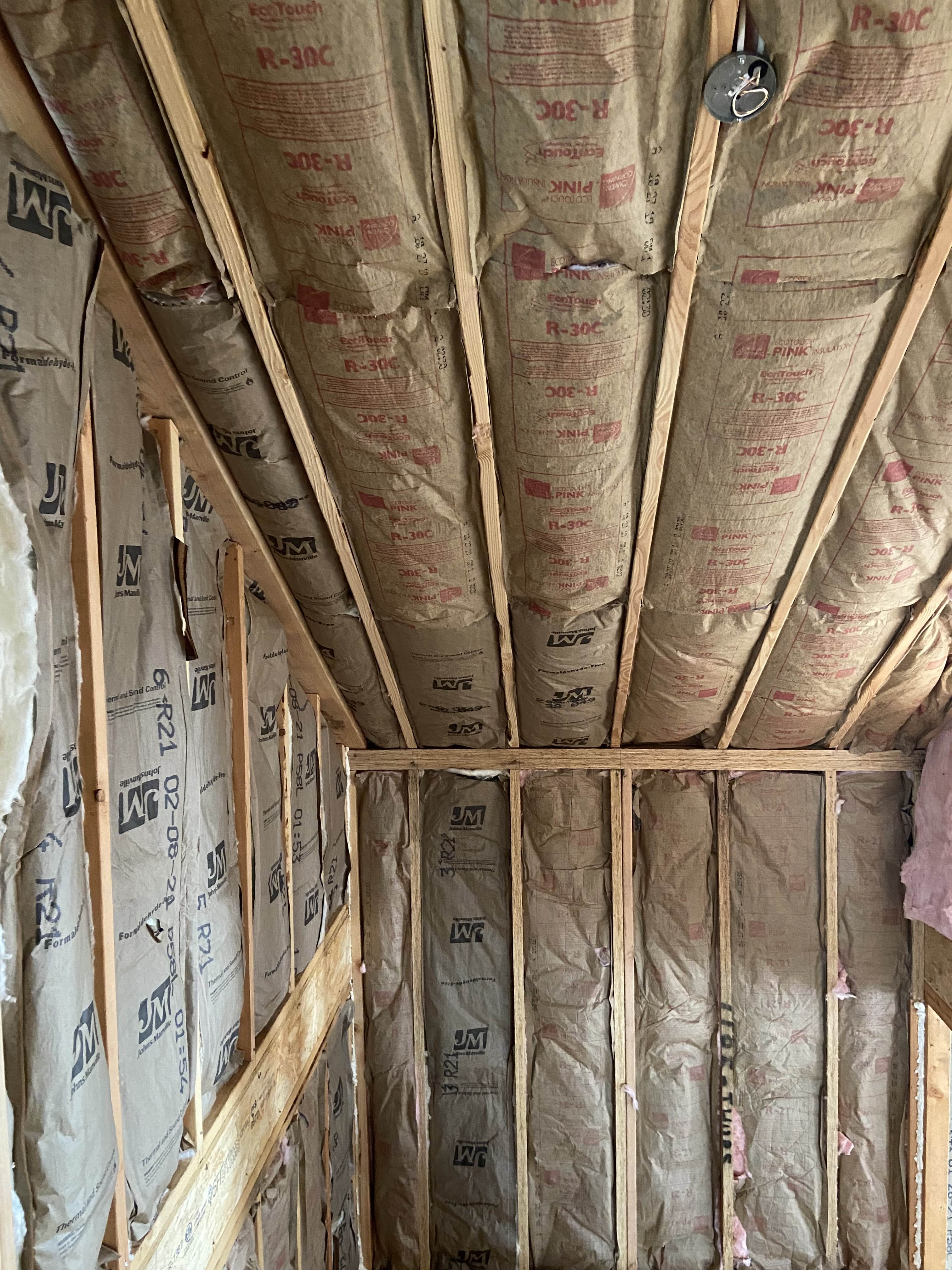 paperbacked Johns Manville insulation in corner