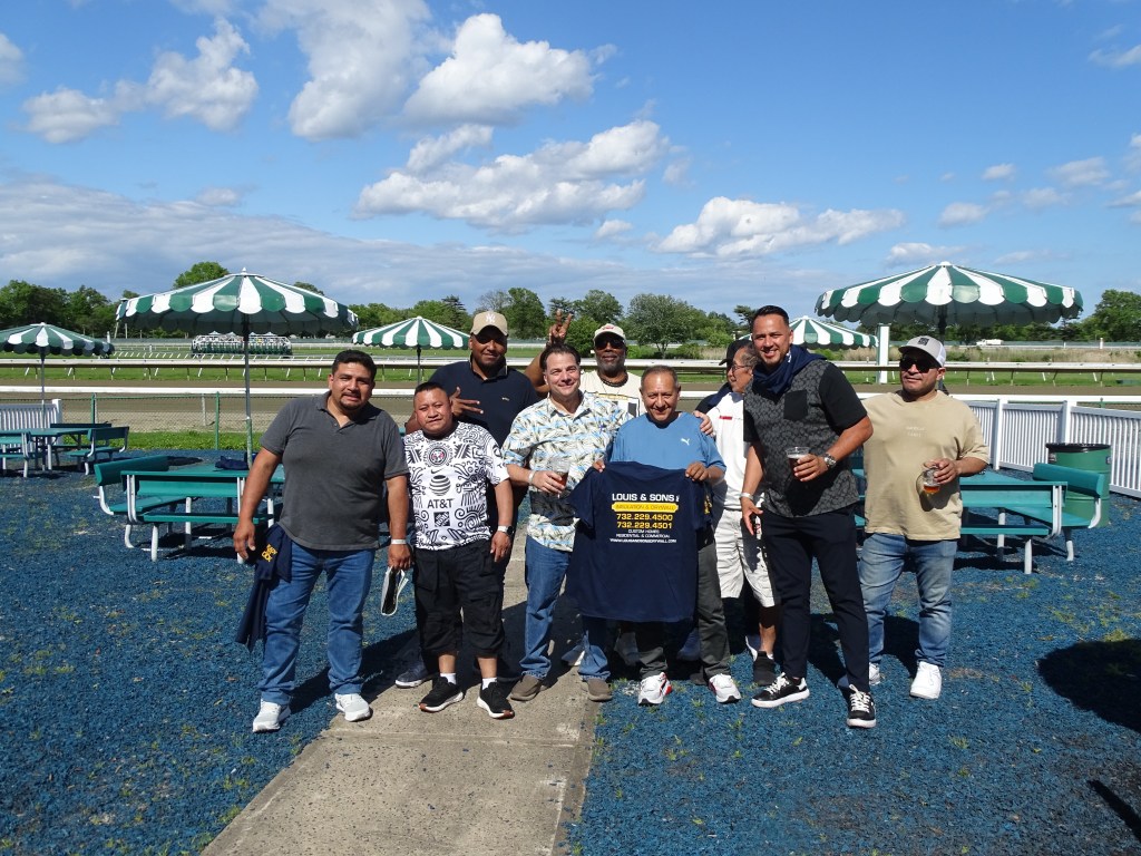 group shot of Louis & Sons team at the racetrack