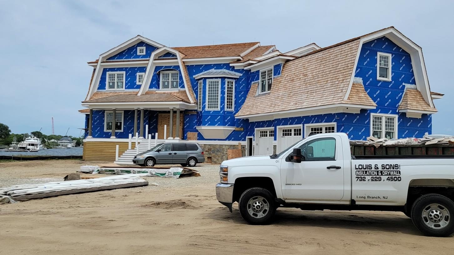 louis and sons truck in front of house