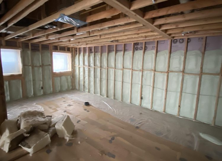 Basement with green spray foam insulation in Livingston, NJ Gemini Spray Foam Systems