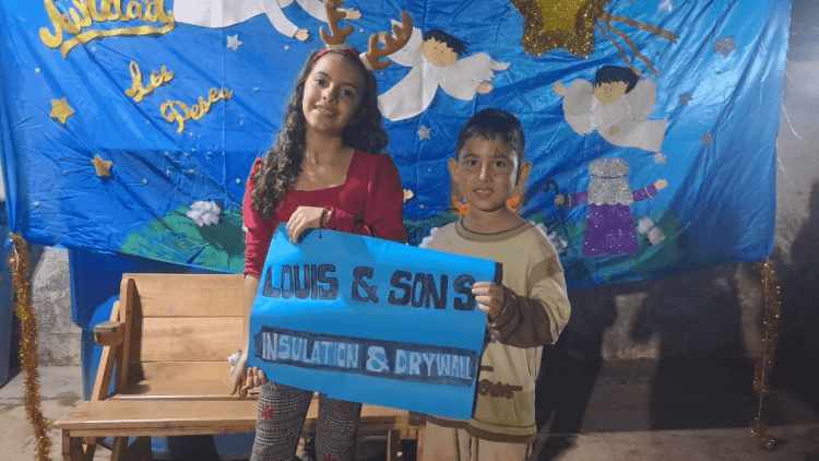 Kids in Venezuela holding Louis and Sons sign