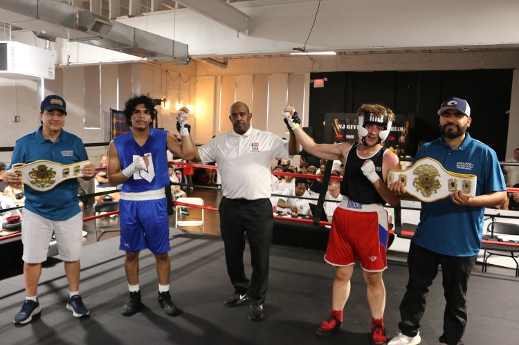 Mike and Guillermo holing winning belts